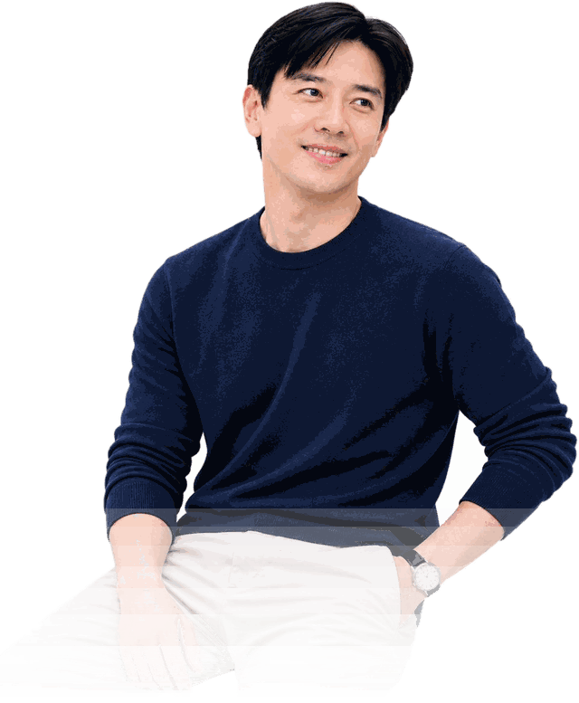 Dato' Seri Ivan Teh seated in a khaki blazer and jeans, smiling